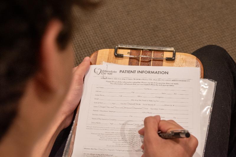 dental patient filling out forms