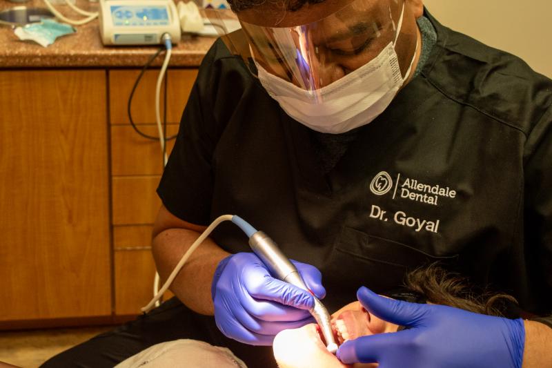 Dr. Goel performing dental care